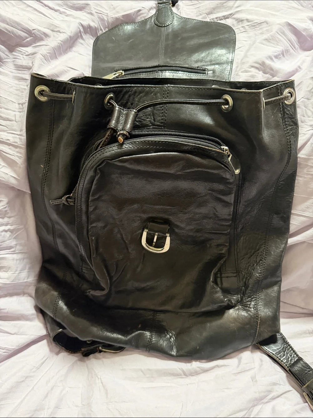 Wilsons Leather Black Drawstring Leather Backpack with Front Zip Pocket
